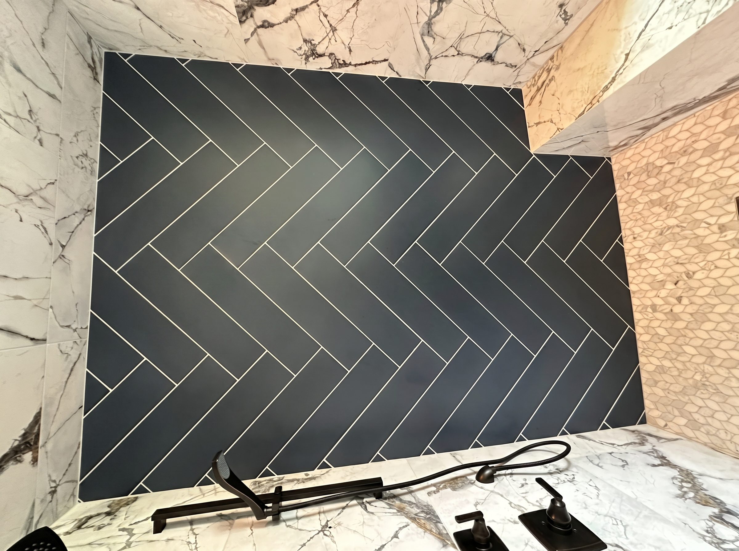 205th Lakeville — Charcoal Herringbone Accent Wall with Calacatta Marble