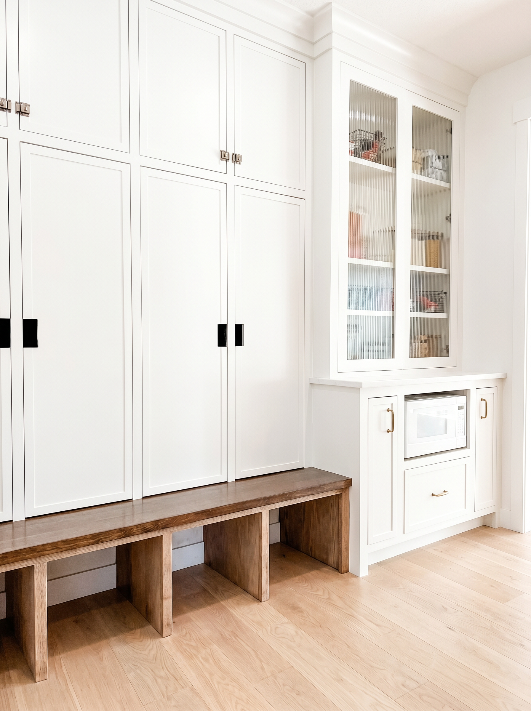 Dewey Hill kitchen range wall with custom hood and floor-to-ceiling cabinetry