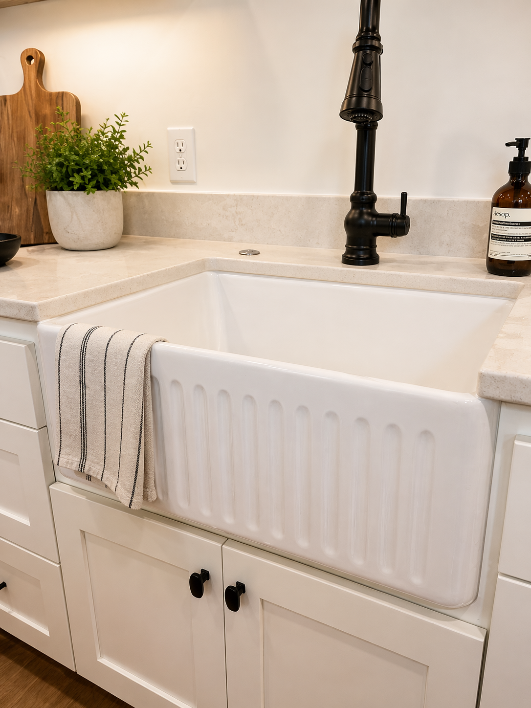 Douglas Mendota Heights — Farmhouse Sink Close-up with Matte Black Faucet