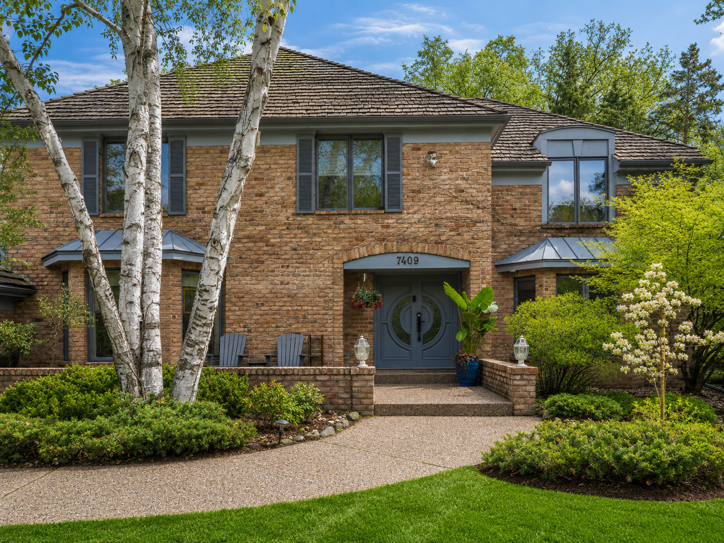 Light for Art — Front Entry with Brick Facade, Arched Door and Birch Trees