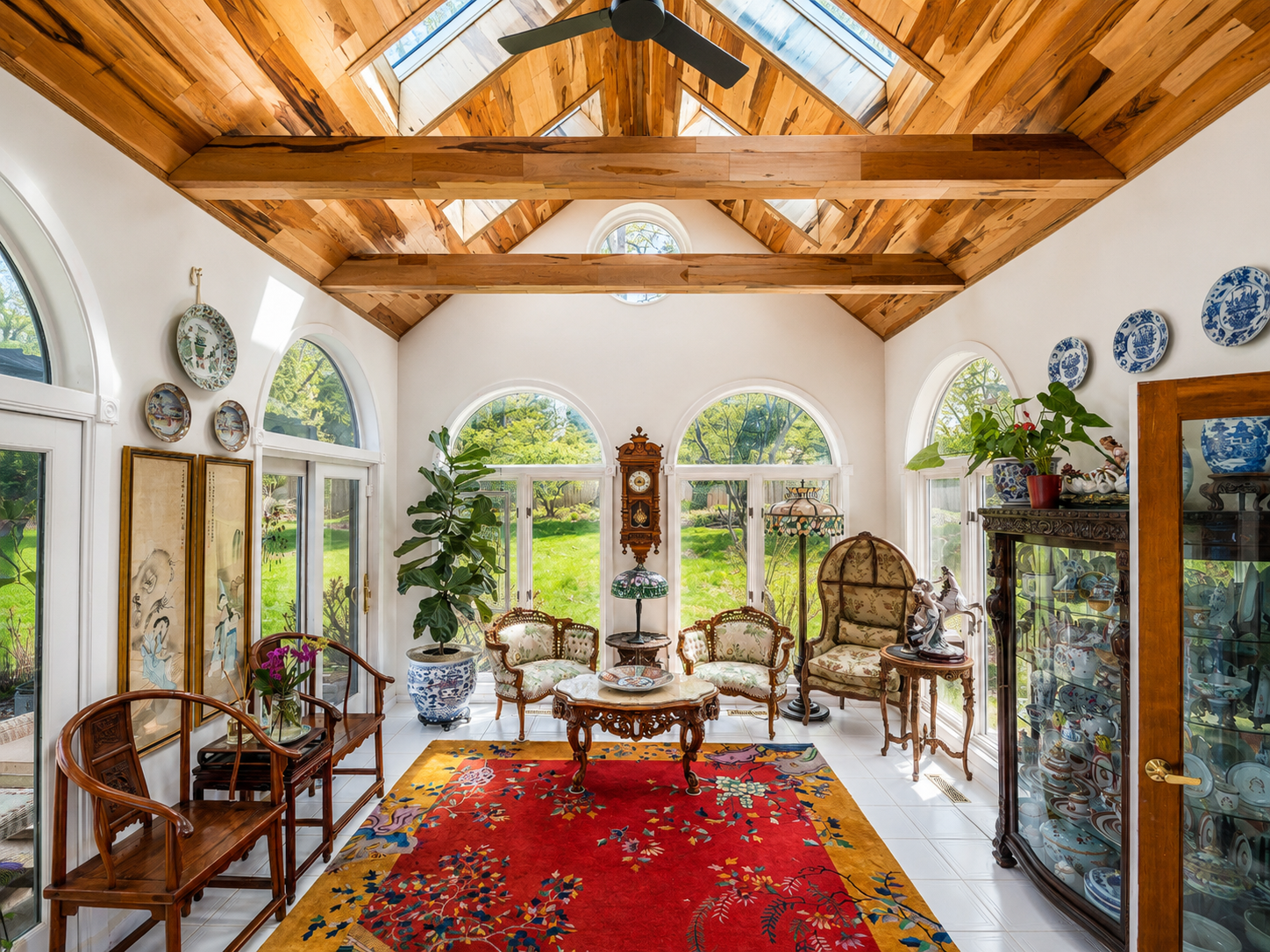 Light for Art — Sunroom Interior with Chinese Art Collection and Arched Windows